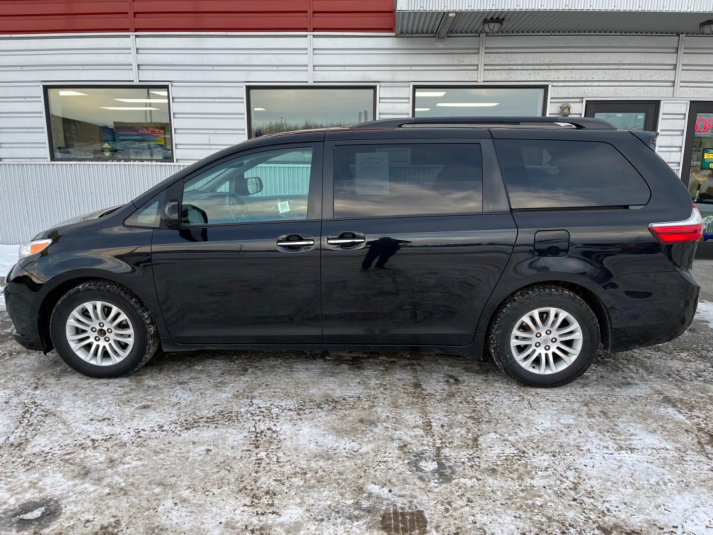 2016 BLACK /Gray Toyota Sienna XLE FWD 8-Passenger V6 (5TDYK3DC5GS) with an 3.5L V6 EFI DOHC 24V engine, 5A transmission, located at 1960 Industrial Drive, Wasilla, 99654, (907) 274-2277, 61.573475, -149.400146 - Photo#1